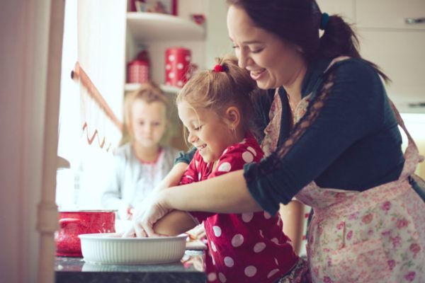 family in kitchen baking food global resort homes rentals